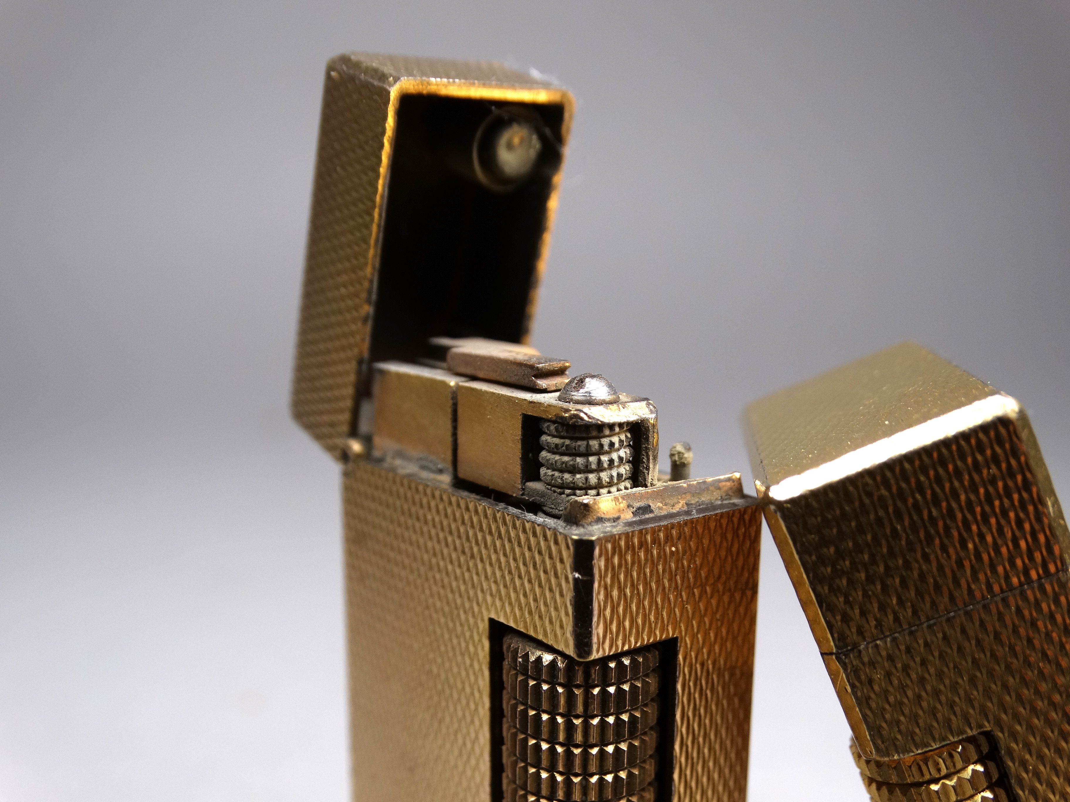 A vintage Dunhill Rolagas lighter - gold plated, engine turned and of rectangular form, height - Image 4 of 5