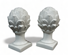 A pair of contemporary white glazed pineapple finials - raised on a square base, height 31cm.