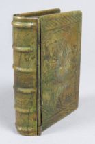 A 19th century brass snuff box - modelled as a book, the cover engraved with a cockerel.