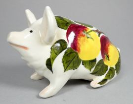 Wemyss Griselda Hill pottery pig - seated, decorated with apples, 18cm wide