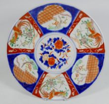 An early 20th century Japanese Imari charger - decorated in typical fashion with vignettes, diameter