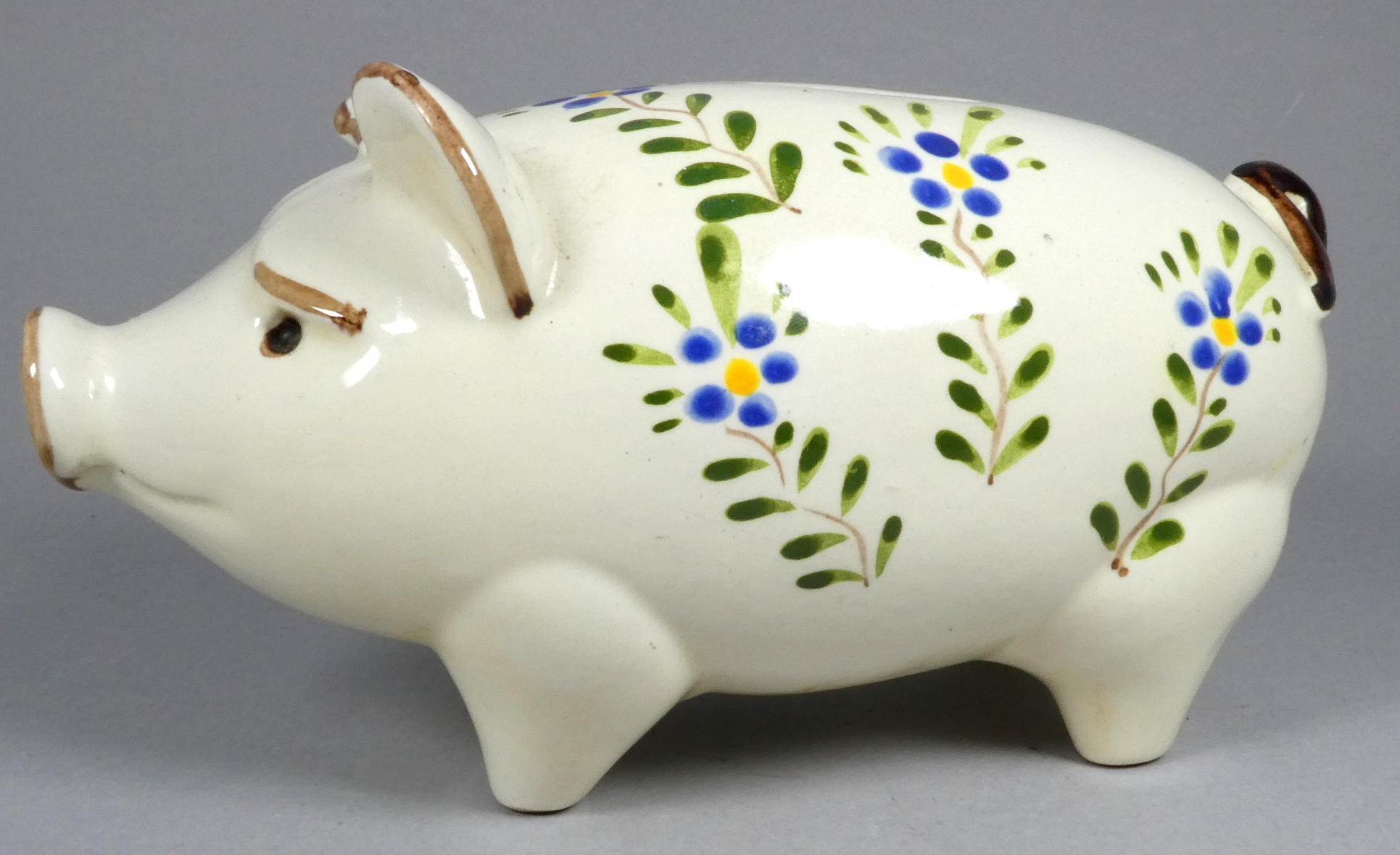 A Quimper pottery piggy bank - decorated with flowers, 21cm wide, together with another larger - Image 6 of 8