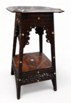 An Islamic hardwood occasional table - the square top with cusped corners and carved with stylised