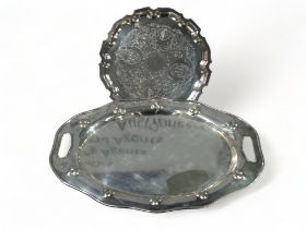 A large oval silver plated twin handled tray - with foliate decoration, width 51cm, together with