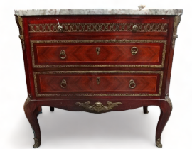 A Louis XVI style marble topped commode - the rectangular top with cusped corners above an