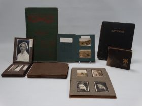 A quantity of early 20th century postcards - together with family photographs from the early 20th