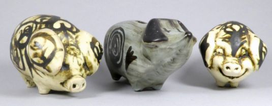 A Rye Pottery piggy bank - grey glazed, 22cm wide, together with two further pottery pigs (3)