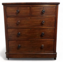 A Victorian mahogany chest of drawers - the rectangular top above an arrangement of two short and