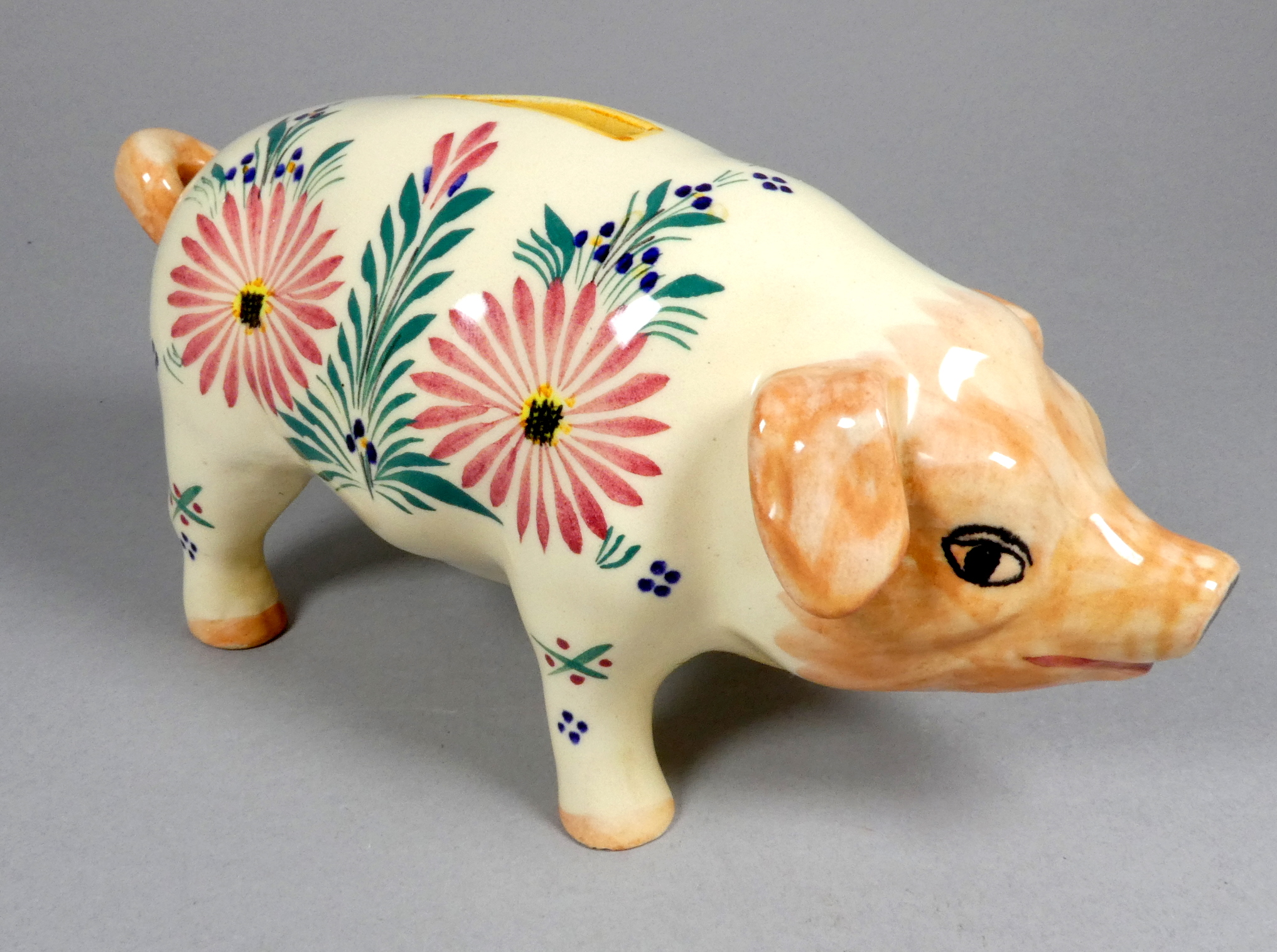 A Quimper pottery piggy bank - decorated with flowers, 21cm wide, together with another larger - Image 2 of 8