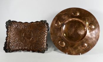 A 19th/20th century circular copper tray - with a broad rim set with 'cabochon' decoration, diameter