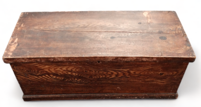 A late 19th century painted pine trunk - of rectangular form, with a faux wood grain finish and