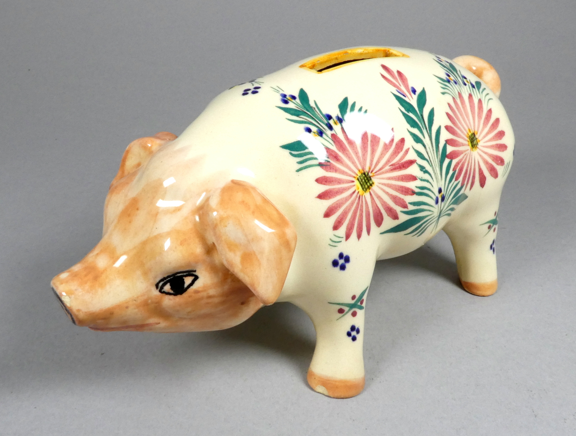 A Quimper pottery piggy bank - decorated with flowers, 21cm wide, together with another larger - Image 3 of 8