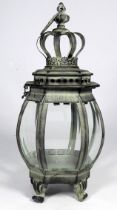 A verdigris lantern - with bellied bevelled glass panels, height 33cm.