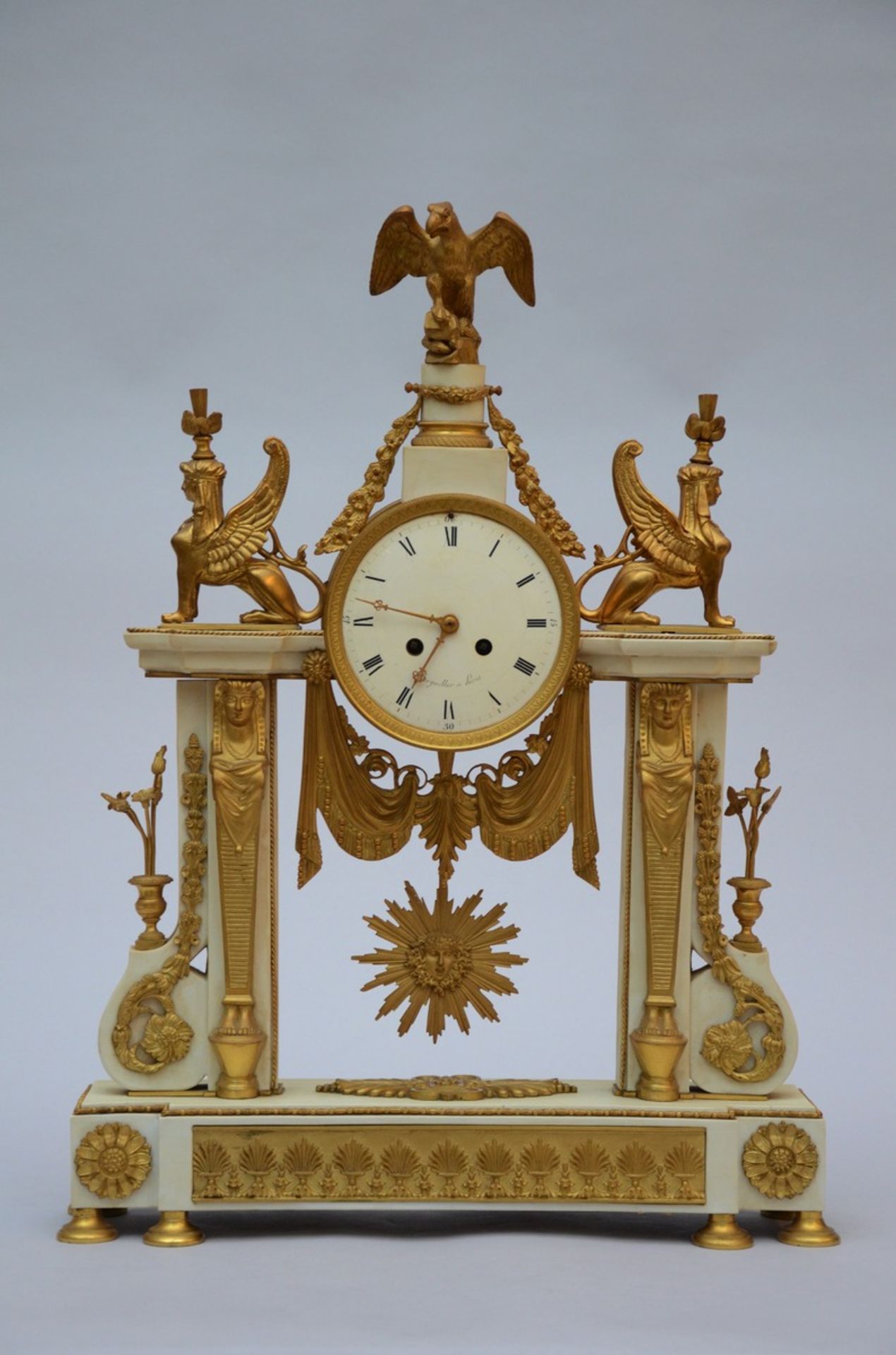 A Louis XVI style clock in bronze and SËvres biscuit 'Bergmiller a Paris' (62x45x12cm)