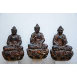 Three lacquered Buddhas in wood, China 20th century (104x65x46cm) (*)