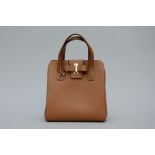 Delvaux: a beige handbag (31x28x18cm)