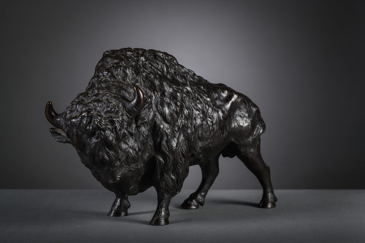 A Japanese bronze okimono 'bizon', signed (25x38x15cm)