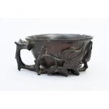 A Chinese libation cup in hardwood, Qing dynasty (5x10x8.50cm) (*)