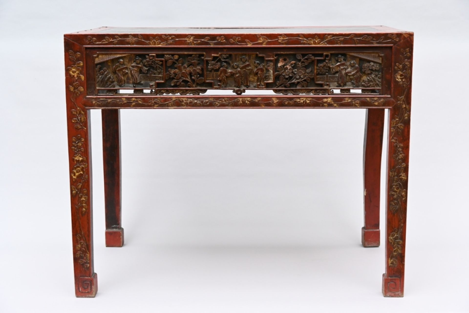 Chinese table in red lacquer with openwork panels, Qing dynasty (75x95x52cm) (*)