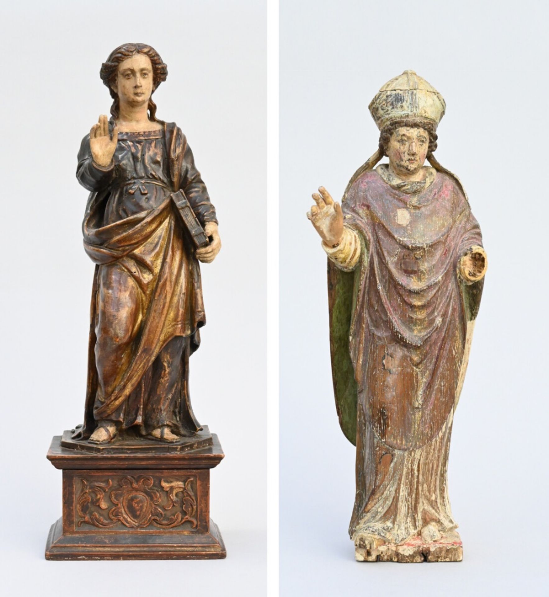 Two polychrome wooden statues 'Saint Lucy' and 'Bishop' 17th - 18th century (h46 - 49cm) (*)