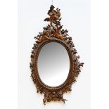 A fine sculpted wooden mirror 'putti' (152x85cm) (*)