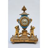 A clock in SËvres porcelain and gilt bronze, 19th century (59x54X20cm) (*)