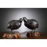 A pair of Japanese bronze okimono's on wooden base 'quails', Meiji period (signed) (h14 - 15cm excl.
