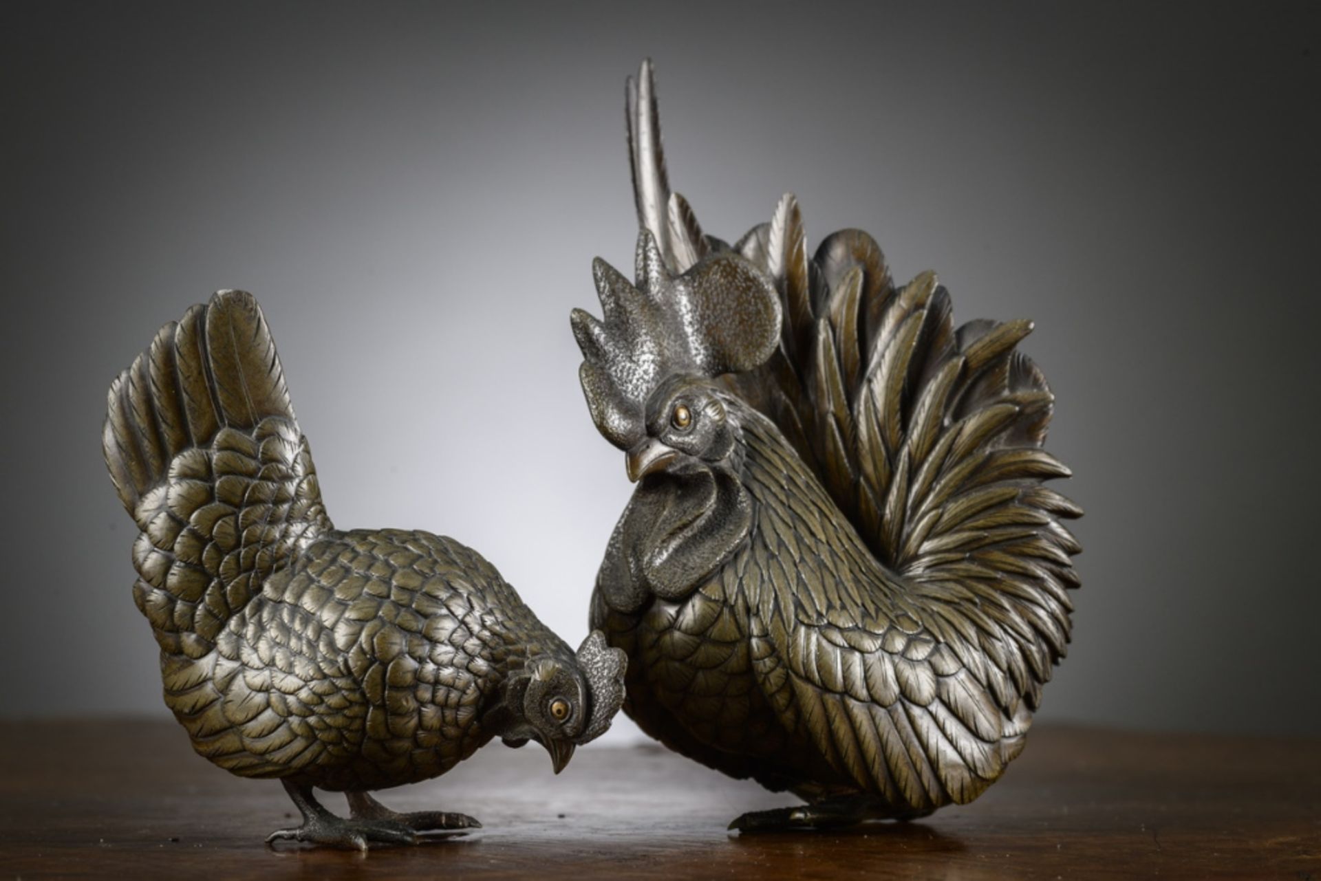 A pair of Japanese bronze okimonos 'chicken and rooster', Meiji period (h10.5cm) (h16cm) (*)