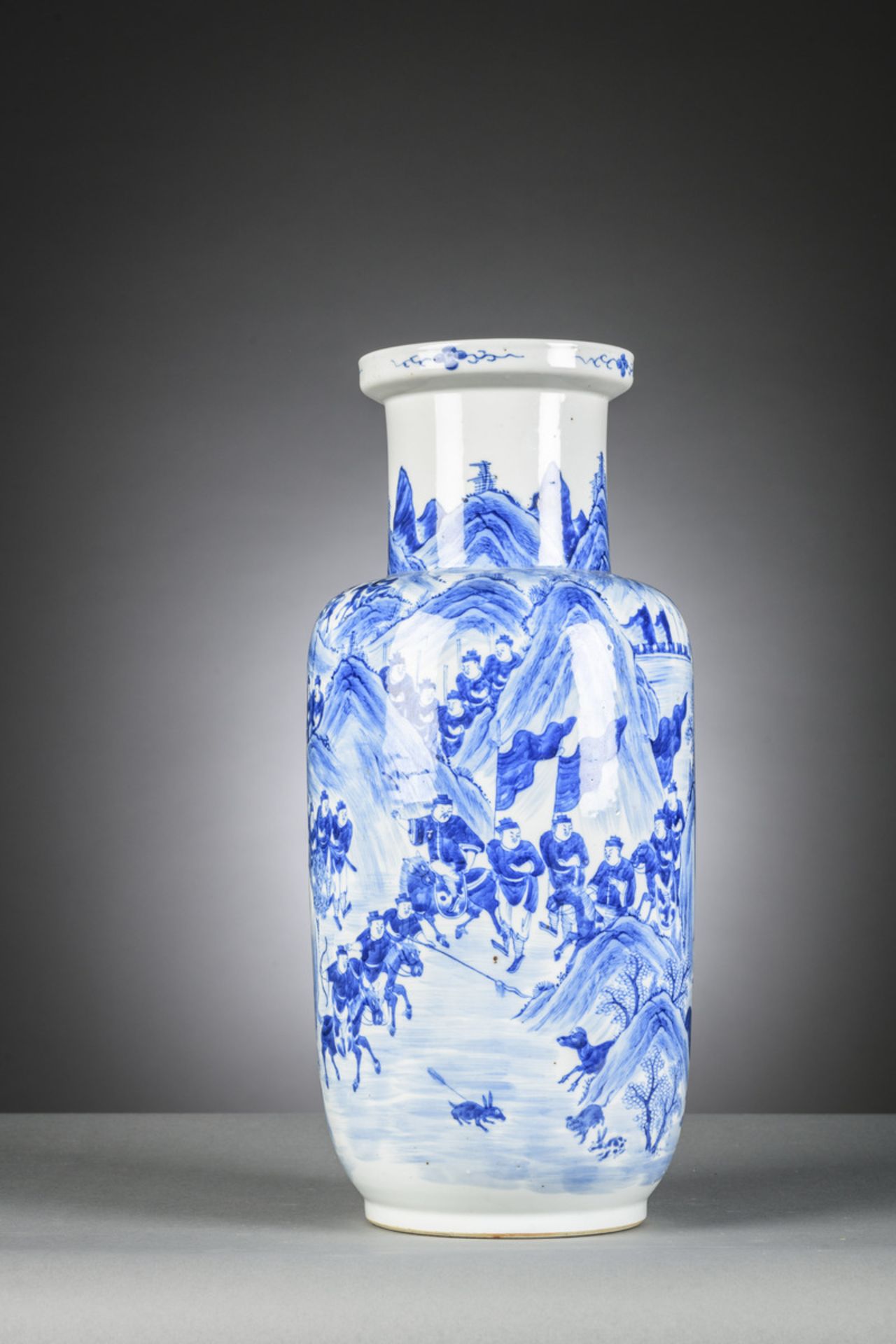 A Chinese blue and white rouleau vase 'the hunting party', 19th century (h40cm)