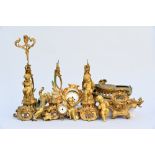 Collection of gilt bronze elements: putti, bells, clockwork holders, supports