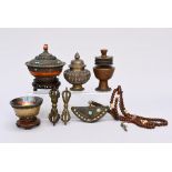 Collection of Tibetan objects: two goblets, two butter lamps, small bag, necklace, two vajras (