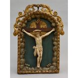 Crucifix in alabaster (43x38cm) with frame (83x59cm) (*)