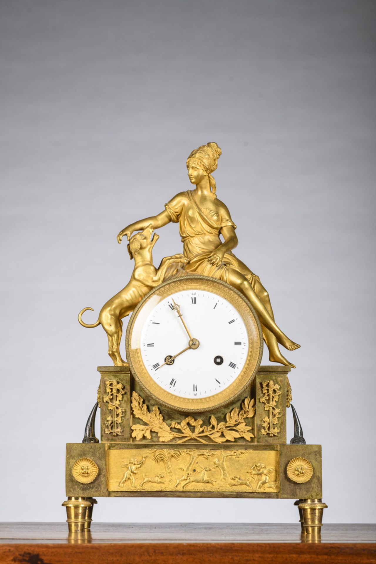 A gilt bronze Empire clock 'girl with dog' (h42x27x9.5cm)