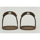 A pair of Tibetan stirrups in cast iron (h15cm)