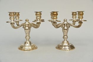 A pair of four-armed candlesticks in solid silver (25x30cm)