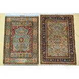 Two Oriental rugs 'vase with flowers' (110x77cm) 'flowers with blue border' (113x75cm)