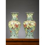 A pair of Chinese famille verte porcelain vases with yellow ground, 19th century (44.5cm)