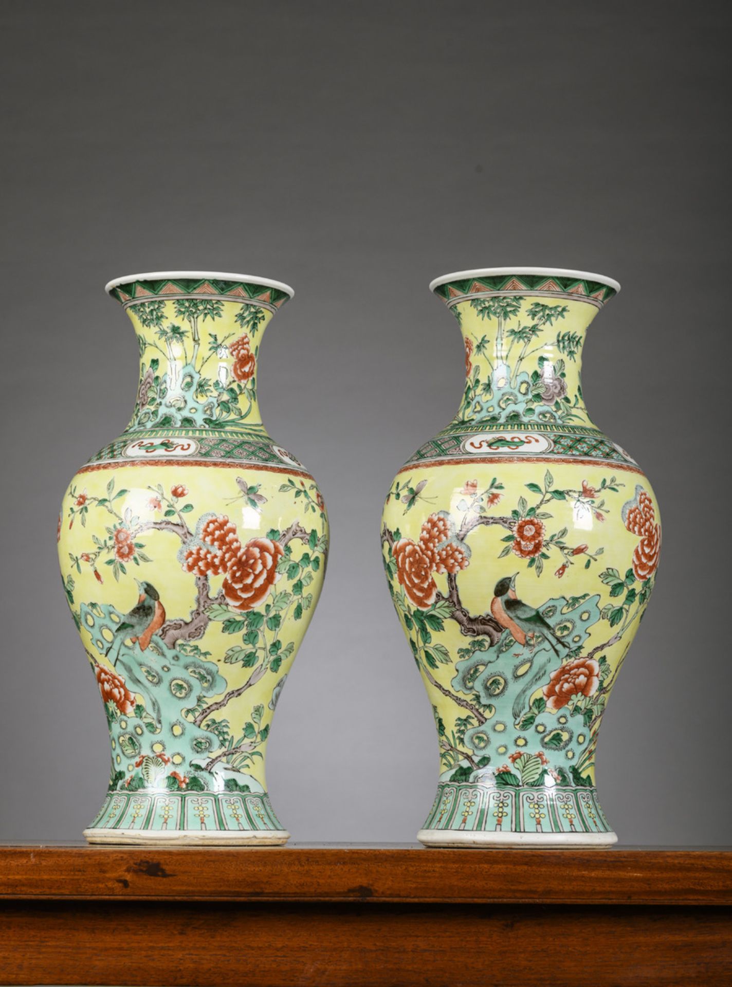 A pair of Chinese famille verte porcelain vases with yellow ground, 19th century (44.5cm)