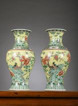 A pair of Chinese famille verte porcelain vases with yellow ground, 19th century (44.5cm)