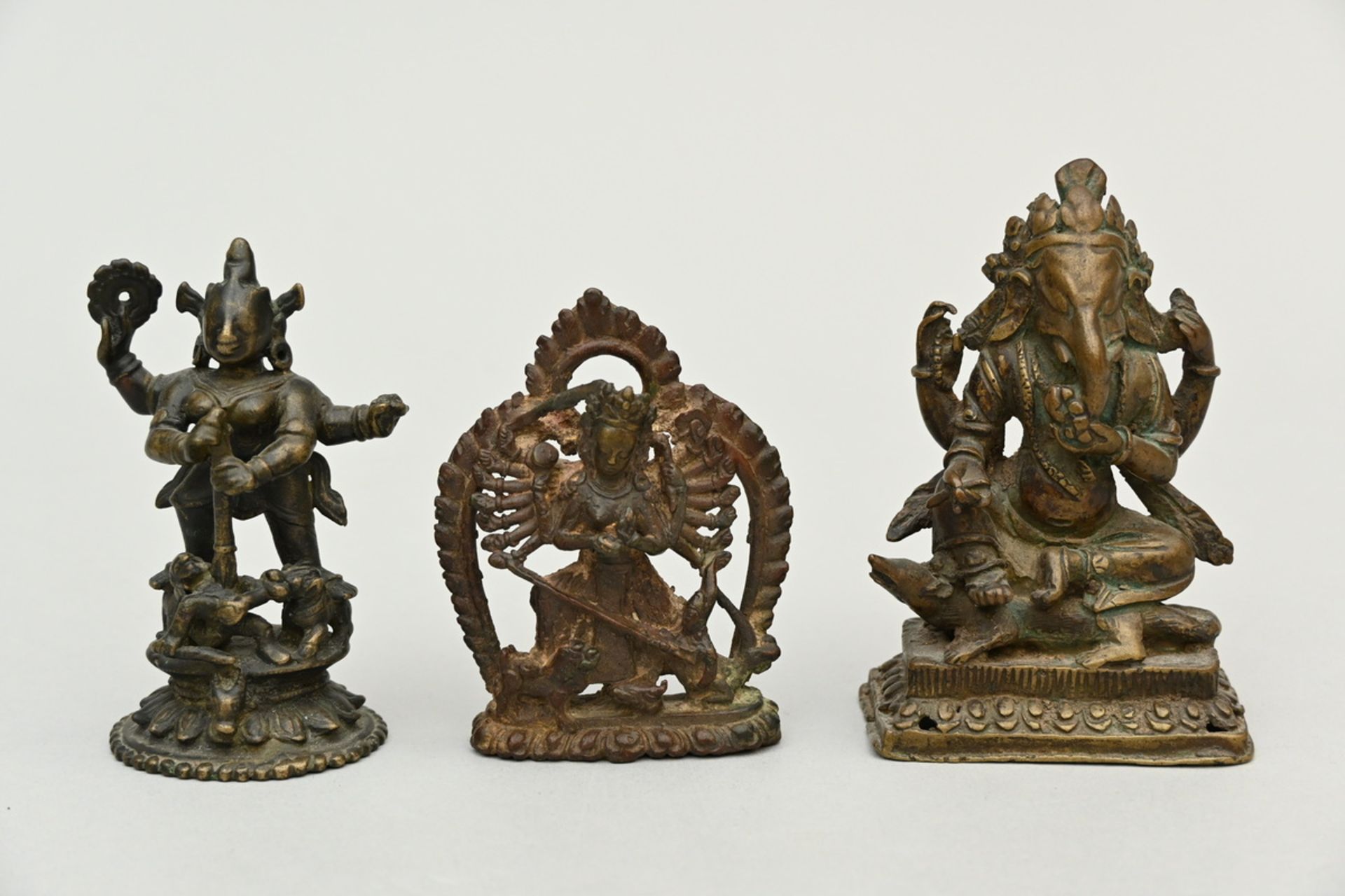 Collection of 3 bronze statues from Nepal and India: Ganesha (11.5cm) Durga (9.5cm) Durga (h10cm)