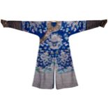 A CHINESE BLUE GROUND SILK BROCADE NINE DRAGON ROBE, CIRCA 1900