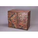 A JAPANESE MEIJI PERIOD (1867-1912) PARQUETRY TABLE TOP CABINET. The panelled double doors lacquered