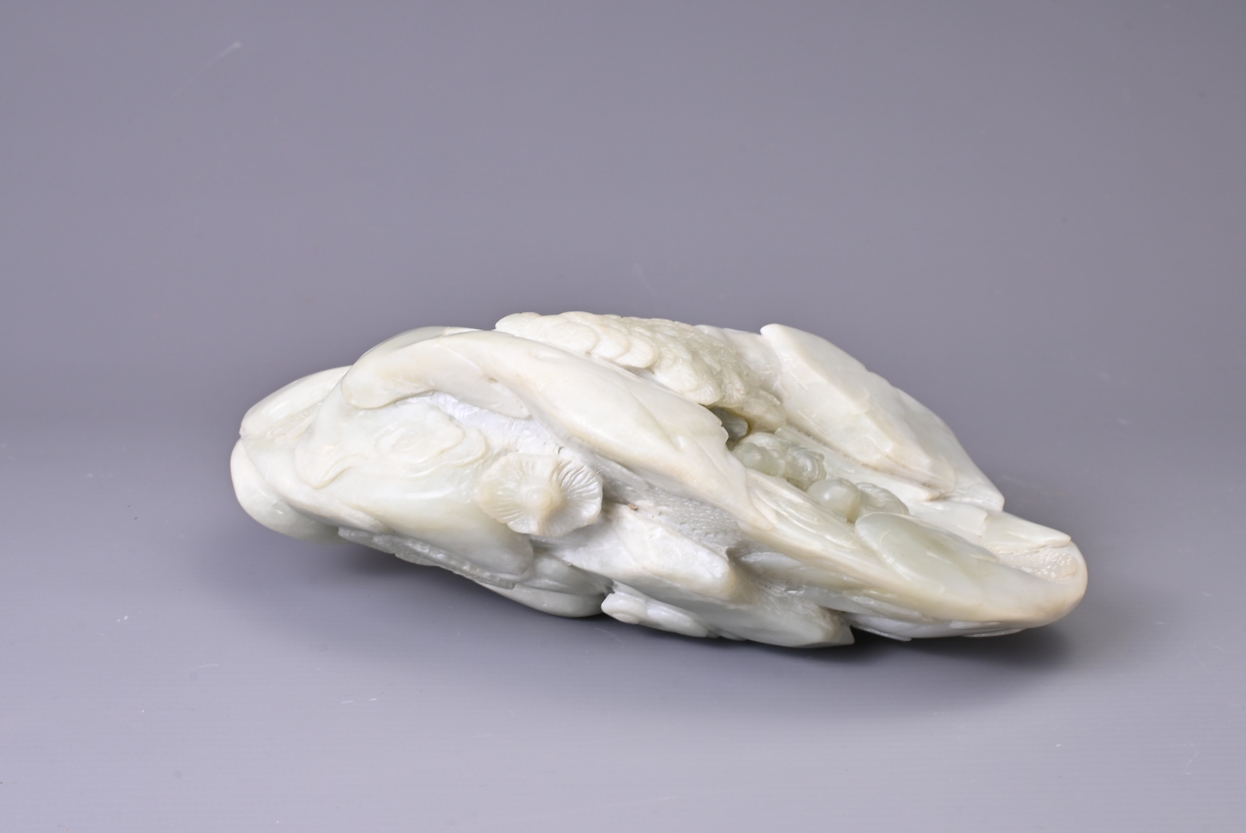 A CARVED PALE JADE BOULDER. Carved with two figures standing on pierced rockwork and trees, with - Image 8 of 8