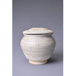 A CHINESE QINGBAI WARE GLAZED PORCELAIN COVERED JAR, SONG / YUAN DYNASTY. Coated inside and out in a