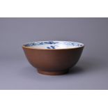A CHINESE BATAVIA PORCELAIN BOWL, 18TH CENTURY. The interior decorated in blue and white with floral