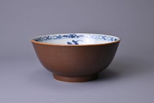 A CHINESE BATAVIA PORCELAIN BOWL, 18TH CENTURY. The interior decorated in blue and white with floral