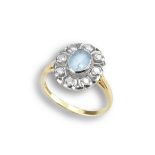 AN ANTIQUE 18CT GOLD AQUAMARINE DIAMOND CLUSTER RING. Central faceted aquamarine cabochon surrounded