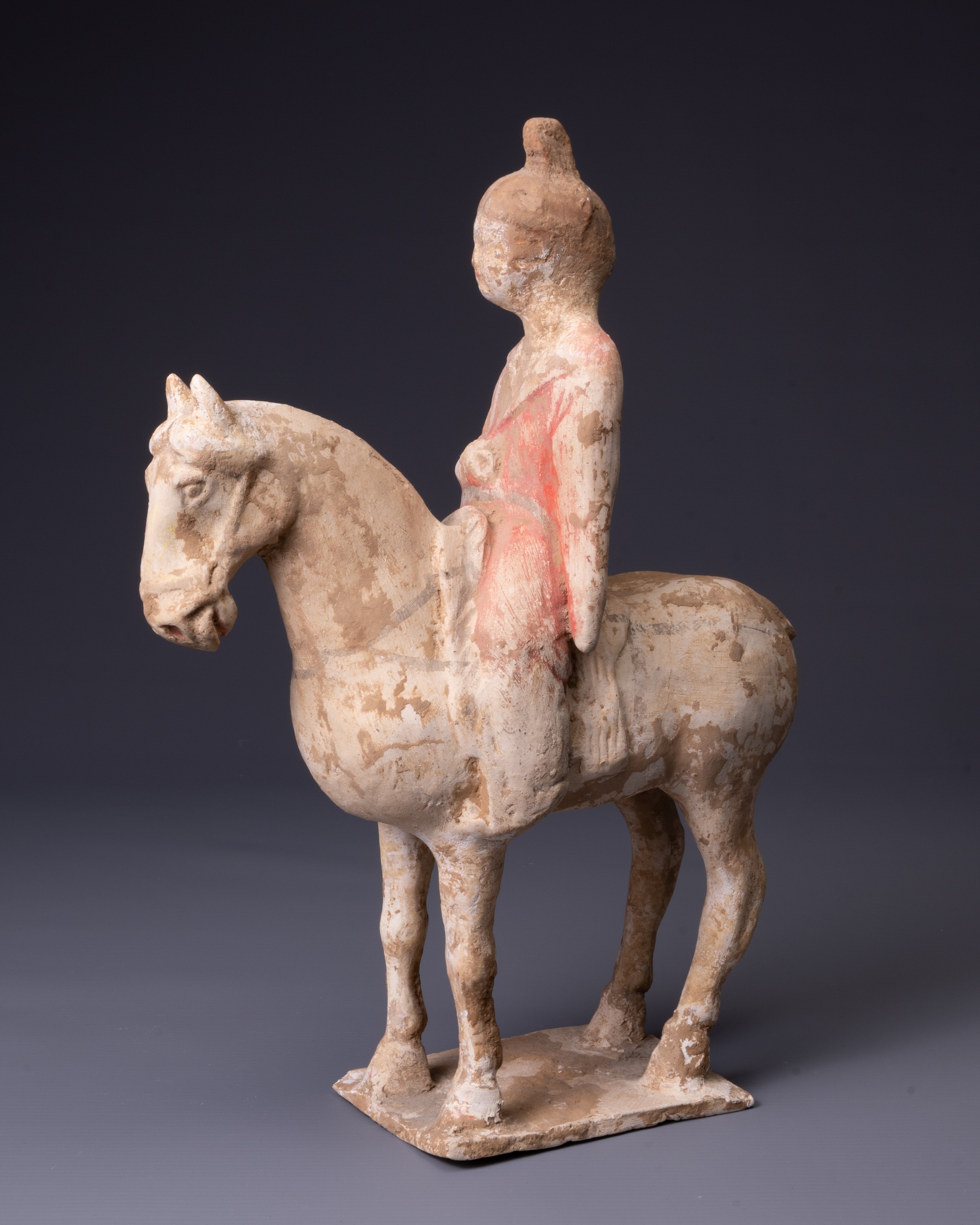 A CHINESE PAINTED POTTERY HORSE AND FEMALE RIDER, TANG DYNASTY (AD 618-907). The horse standing