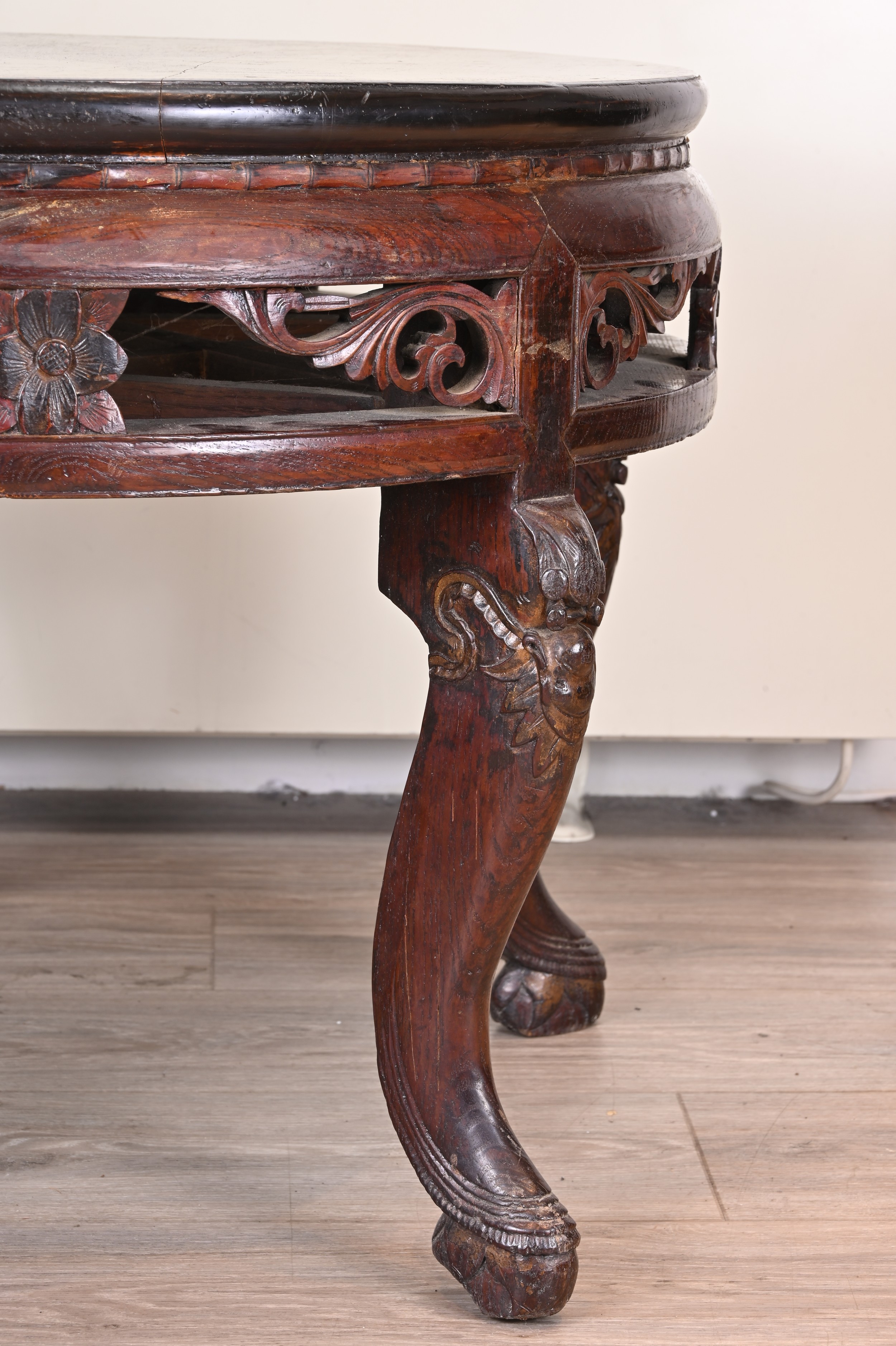 CHINESE 19TH/20TH CENTURY CIRCULAR HARDWOOD LOW TABLE, with black lacquer top and carved floral - Image 6 of 6