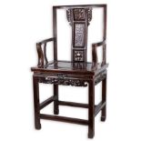 A CHINESE CARVED HARDWOOD ARMCHAIR, 20TH CENTURY. The splat carved and pierced with European looking